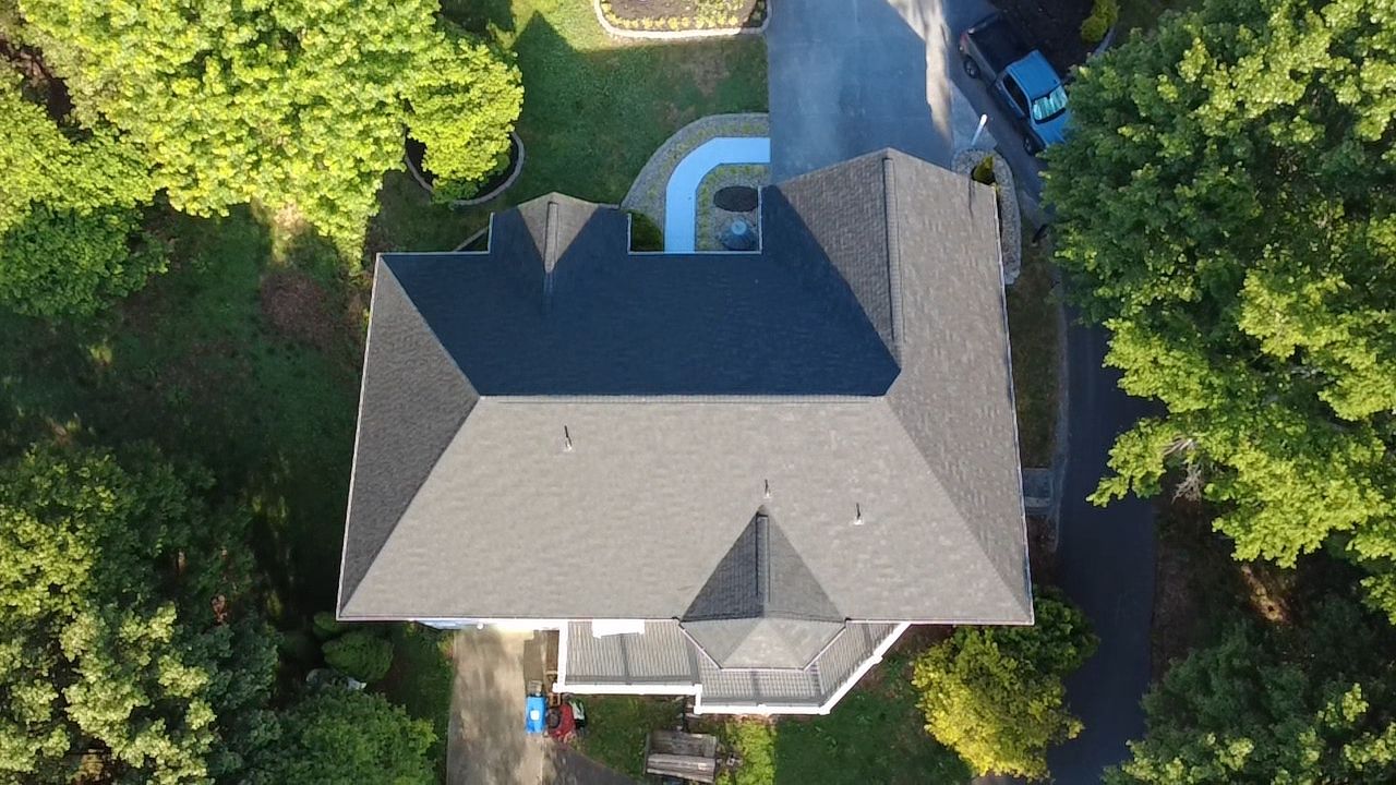 Drone photo of a finished Owens Corning Duration roof in Onyx Black on an East Tennessee home